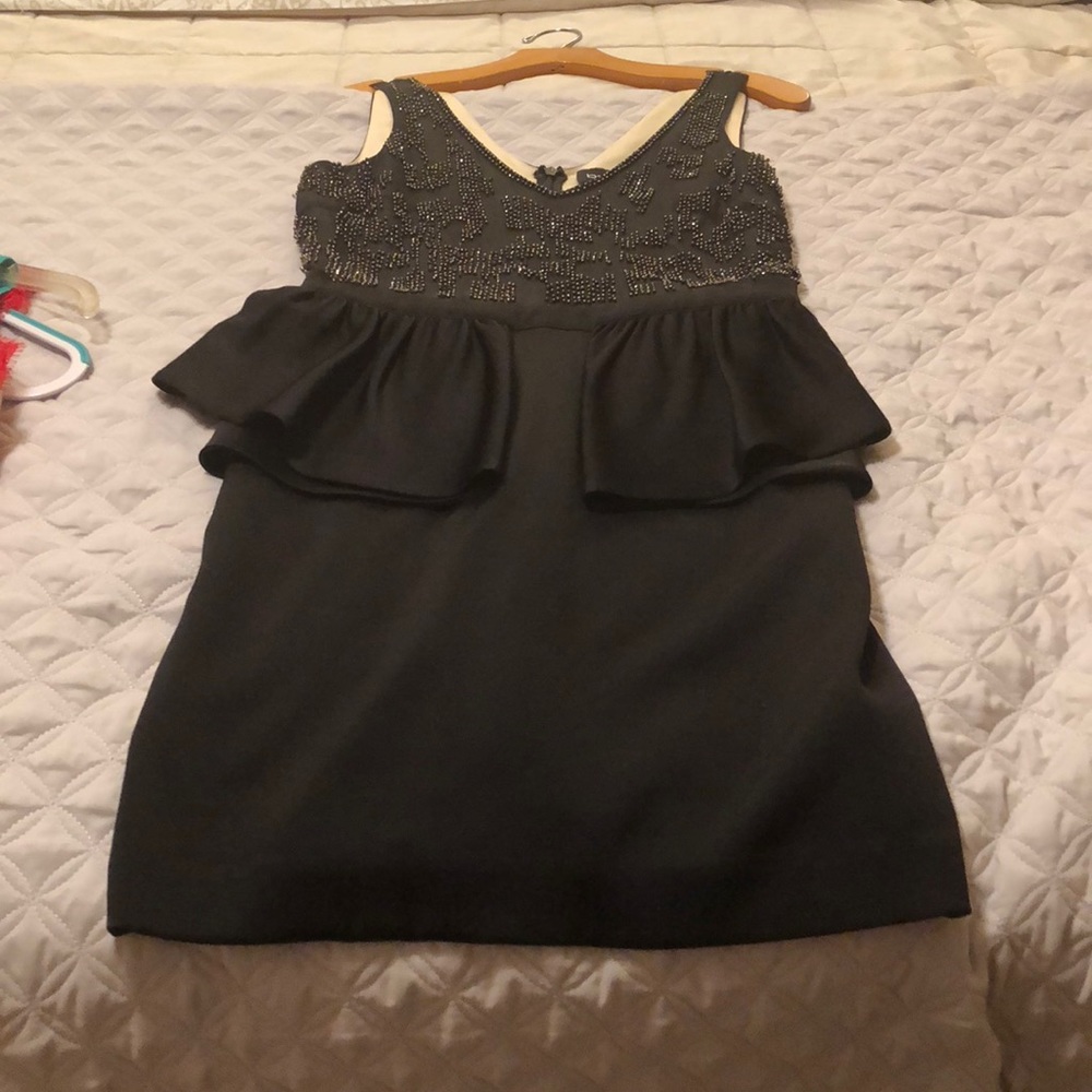 Black mini dress with sequin top.
